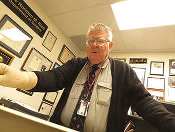 Dr. Norman Rich handling archive materials